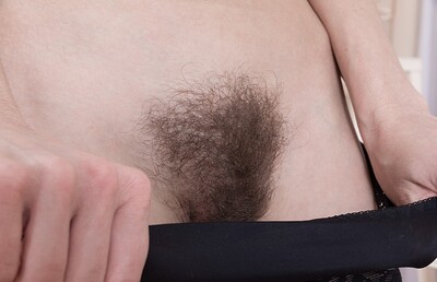 Liliya in Liliya gets naked and masturbates on a table from We Are Hairy