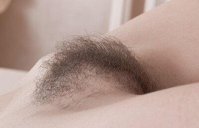 Liliya in Liliya gets naked and masturbates on a table from We Are Hairy