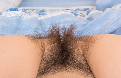 Halmia in Halmia strips naked in bed showing off body from We Are Hairy