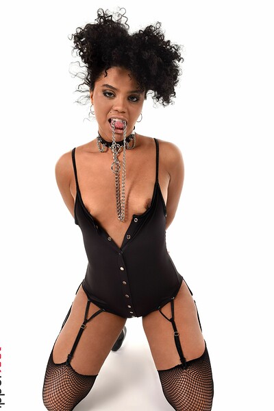 Attractive ebony vixen wearing her black domina set slowly undressing exposing her alluring physique with small natural tits as starts to masturbate with a long black toy