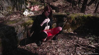 The tempting vixen enjoys her time in the woods as she spanks herself while slowly fingering her snatch