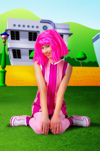 Playful and cute Stacy presents her titties while posing in a cosplay of Stephanie from Lazytown