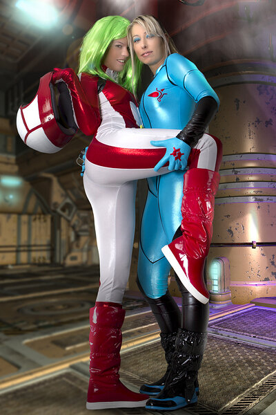 Lesbian gals Ginger and Sandy Bell meet on a spaceship and get naked while cosplaying as Miriya from Robotech and Zero from Samus Aran