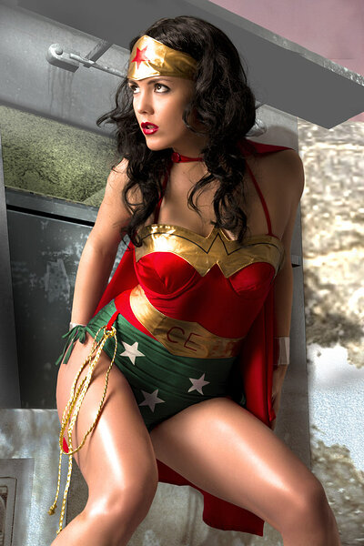Flawless black hair goddess cosplays as a Wonder Woman captivatingly demonstrating her curves with big natural tits