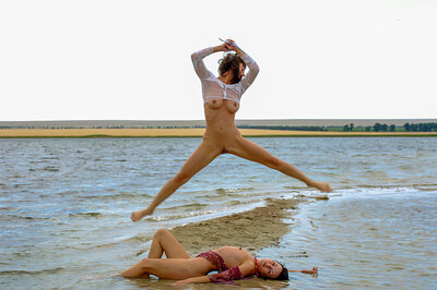 Playful gals Aglaia X and Sophronia Q displaying their natural bodies while having fun at the beach