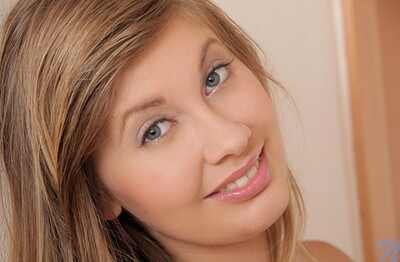 Holly Belle in Hallway pink spread from Nubiles