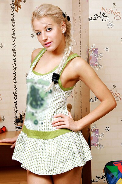 A horny teenage girl named Uliana is fingering herself with a toy.