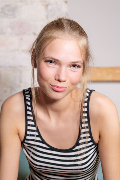 A hot blonde babe in black tights teases you with glimpses of her tits and bald pussy.