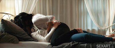 MitziX gazes seductively while massaging Olivia Zlota's shoulders, her curly black hair sway rhythmically.