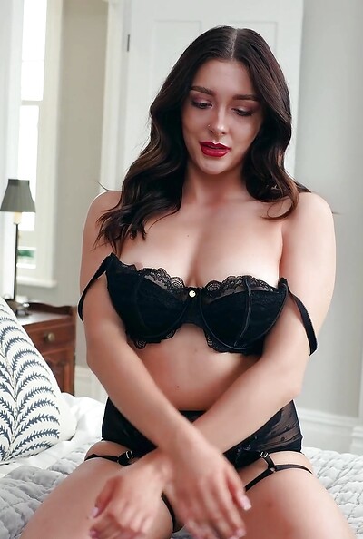 The busty UK babe slowly peels off her lingerie with erotic moves.