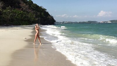 Delilah G's stunning, busty blonde body poses erotically on the beach and in the studio, her irresistible sexiness on full display.