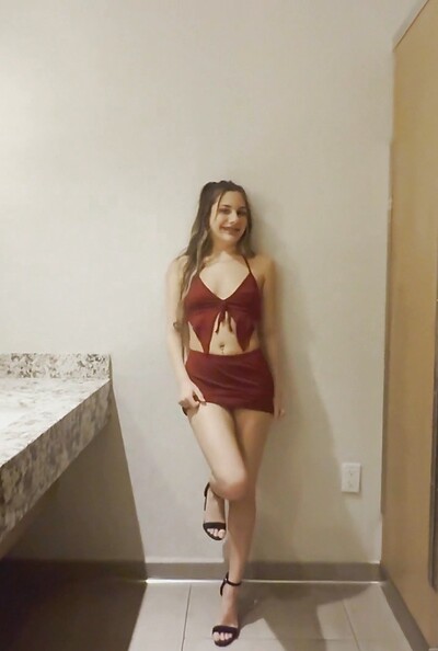 The voluptuous chick flashes her assets and fingers her pussy while playfully exhibiting her body in the mall bathroom.