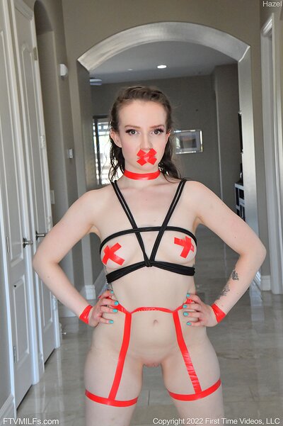 She gags on a long dildo, then fucks herself hard to a moaning climax with tape muffling her screams.