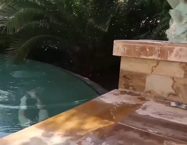 Gillian Barnes jumping out of the pool