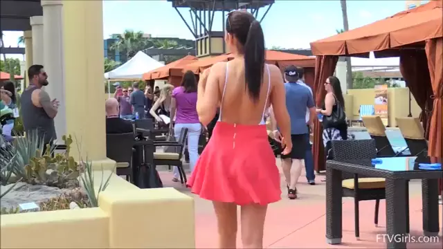 Dancing in public with her tits out
