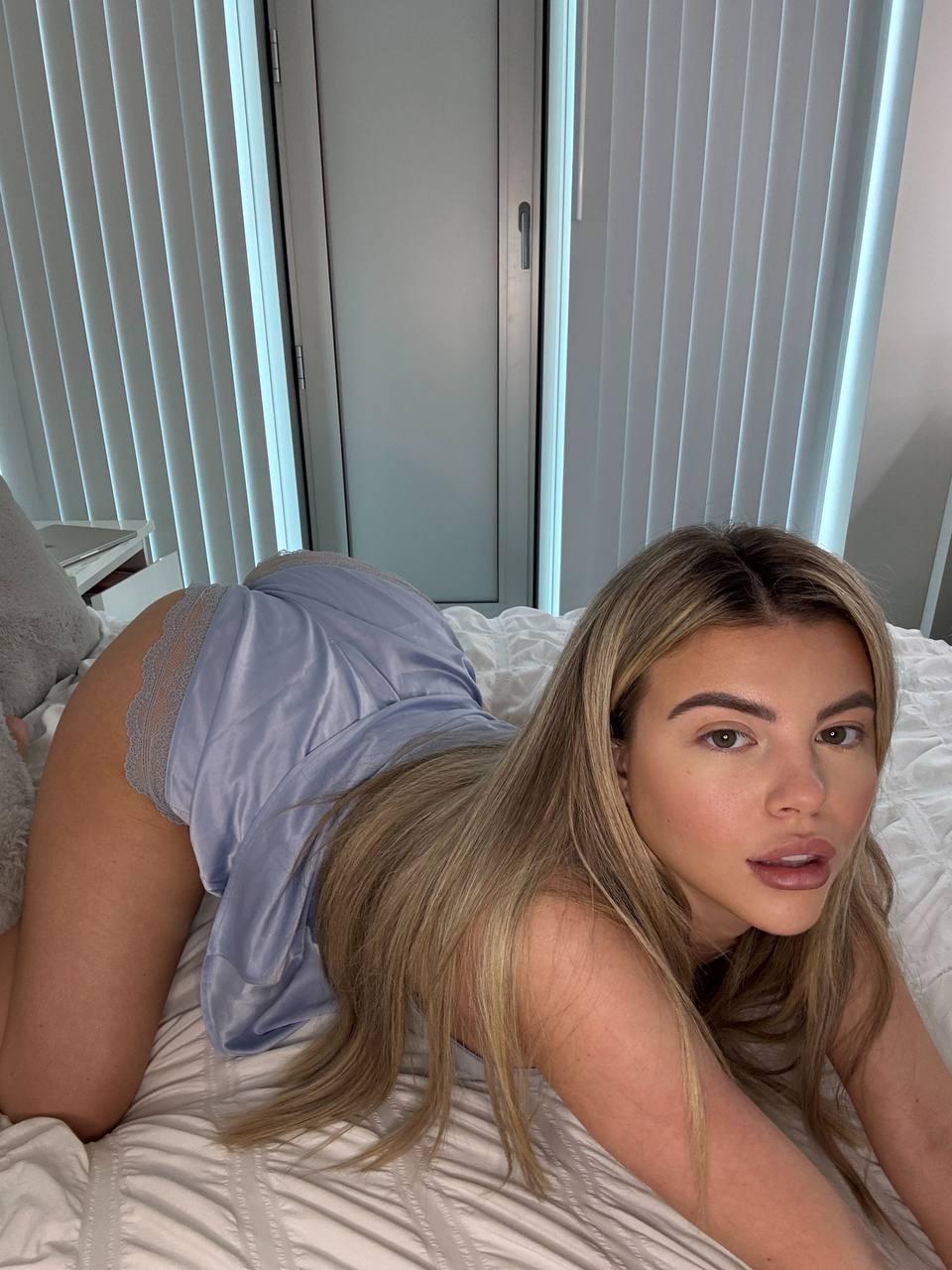 Tilly Harrington's ass is up, wearing lace panties, her long hair cascading, ready to take it all in.