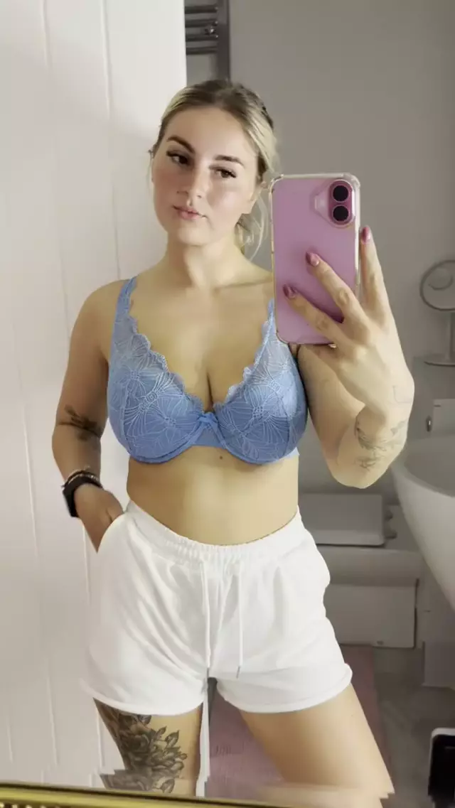 Sofia Bae's large, lace-covered breasts are begging to be touched, her hand teasingly covers one nipple.