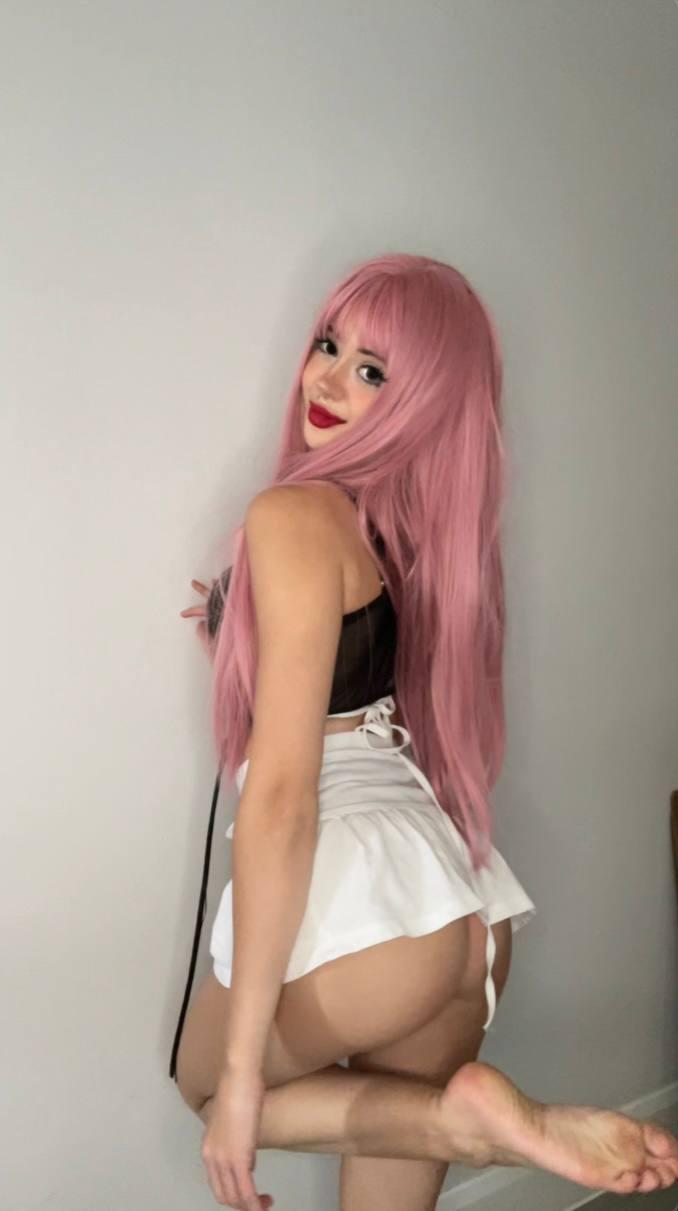 Mimi's pink hair and white skirt tease her bare, round ass, making her feet ache with anticipation.