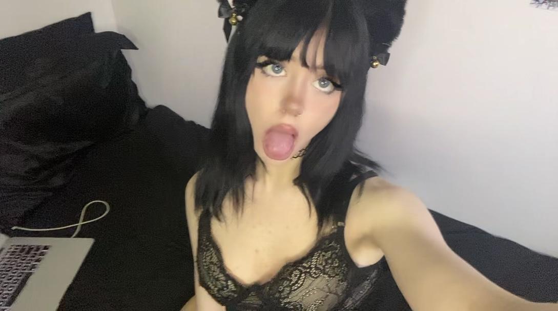 Mimi's tongue is out, her lace bra teasing, her black hair and eyes drawing you in.