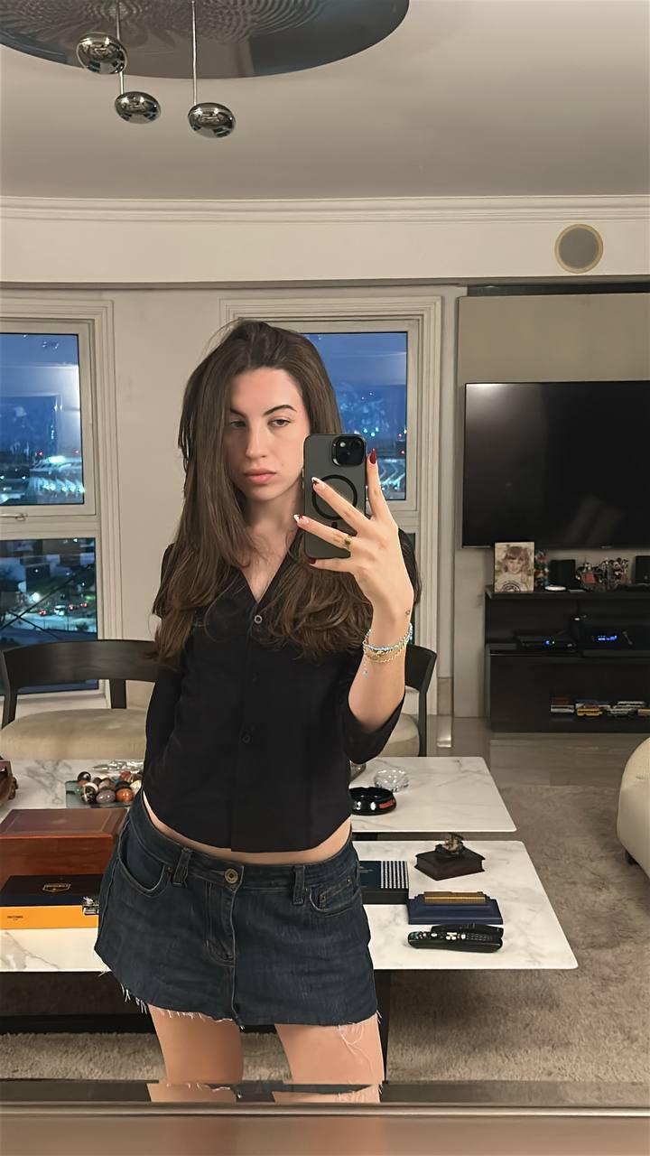 Amber James's wet pussy is throbbing, her fingers teasing her denim skirt, taking a sexy mirror selfie.