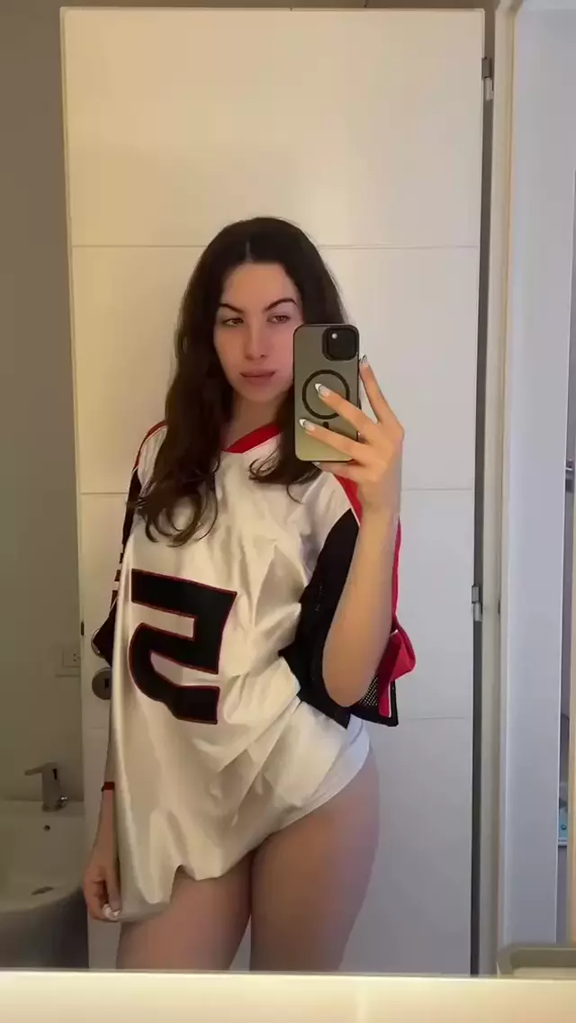Amber James's wet panties tease, her hand gripping her phone, eyes locked on the camera.