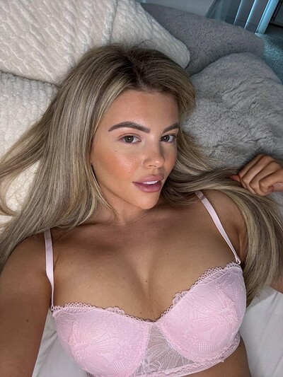 Tilly Harrington's plump lips part slightly, her lace bra teasing her full, eager breasts.