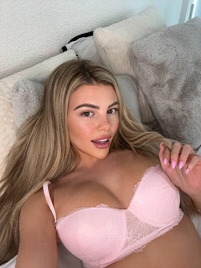 Tilly Harrington's pink lace bra is teasing her nipples, her lips parted in anticipation.
