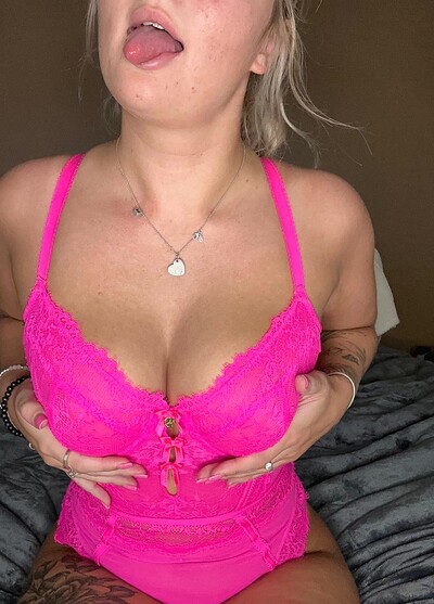 Sofia Bae's tongue teasing, hands squeezing her hot pink lace bra, nipples hard, anticipation building.