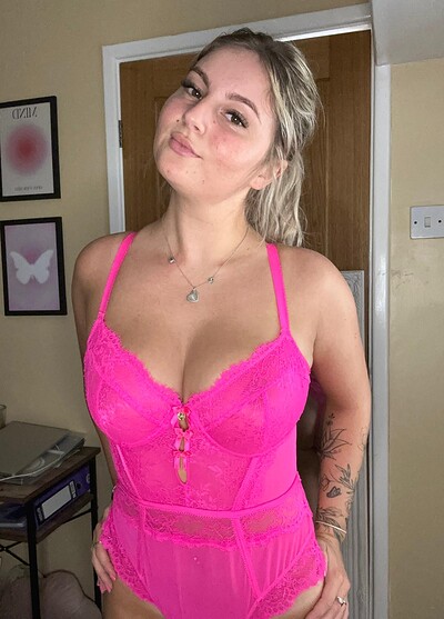 Sofia Bae's pink lace lingerie is teasing her cleavage, making her feel incredibly sexy and ready to please.