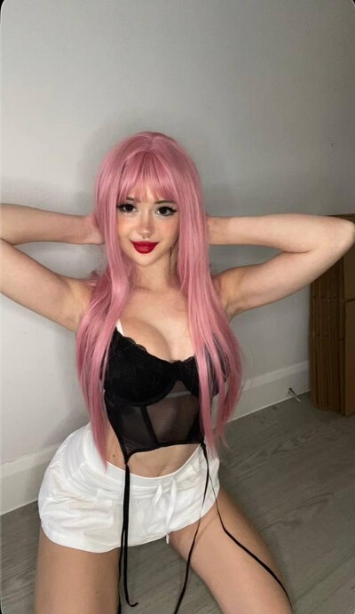Mimi's pink hair, black lace top, and white shorts, hands behind her head, her cleavage teasingly exposed.