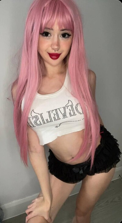 Mimi's pink hair is teasing, her red lips are ready, her black shorts are begging to be pulled down.