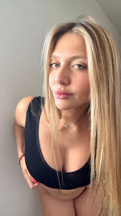 Grace Whitely's wet lips are slightly parted, anticipating a kiss, her green eyes seductively gazing upward.
